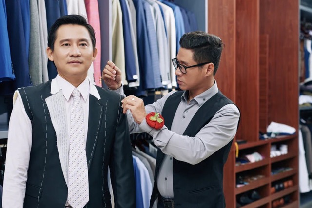 A tailor altering a bespoke suit - Accelerate Your Success with Thorough Training Programs with Pearce Bespoke 