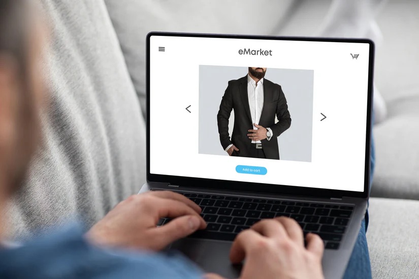 A laptop with an eMarket webpage pulled up - Marketing Strategies for a Thriving Bespoke Suit Franchise with Pearce Bespoke 
