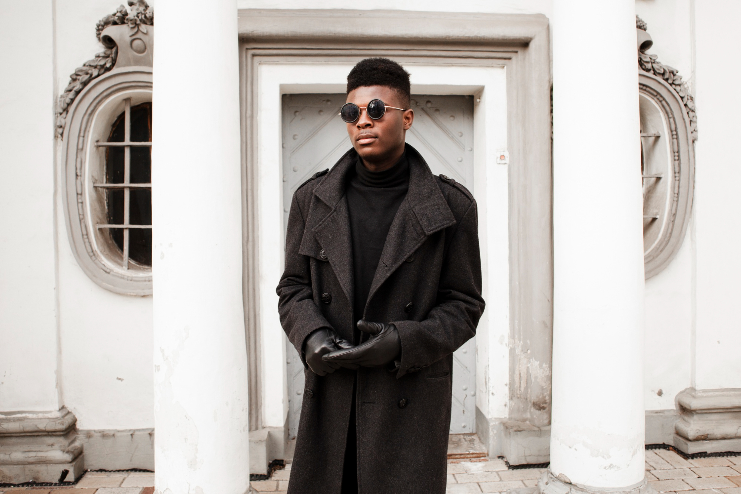 A man in a black overcoat and black accessories — Learn about overcoat trends with Pearce Bespoke Greater Syracuse 