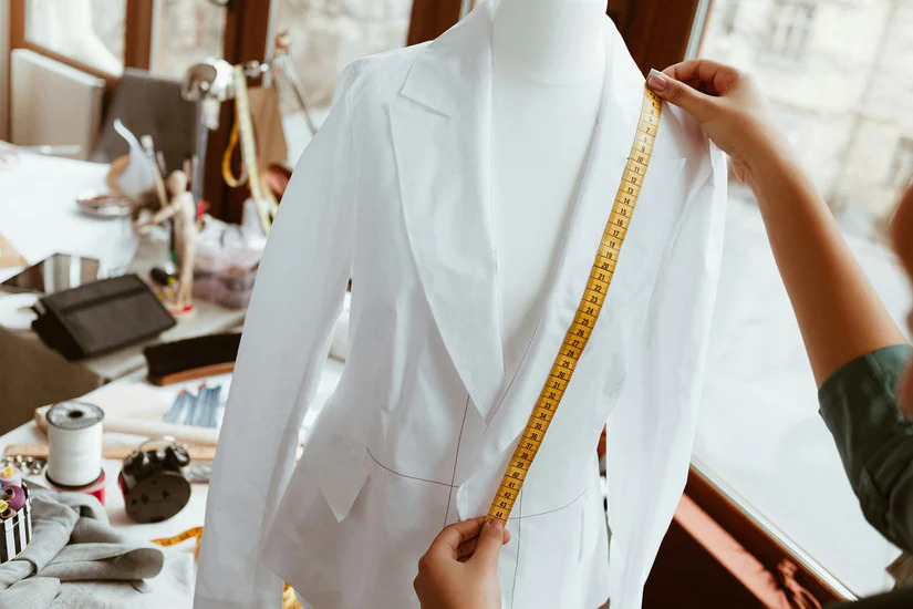 A custom suit being tailored - learn how you can boost your career with Pearce Bespoke.