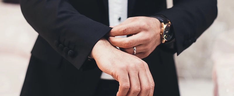 A man wearing an impeccable suit by Pearce Bespoke. 