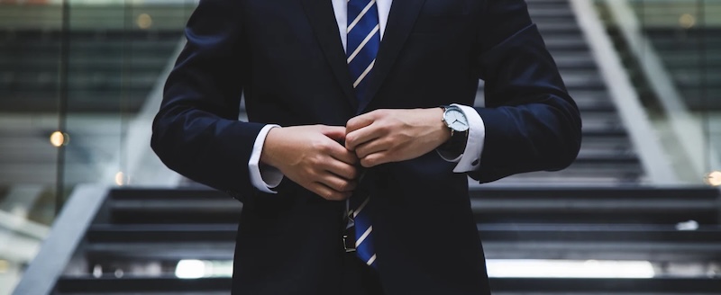 A man in a custom made Pearce Bespoke suit.