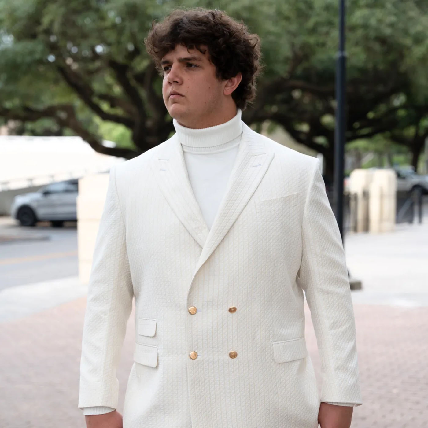 Will campbell wearing a white custom suit from Pearce Bespoke.