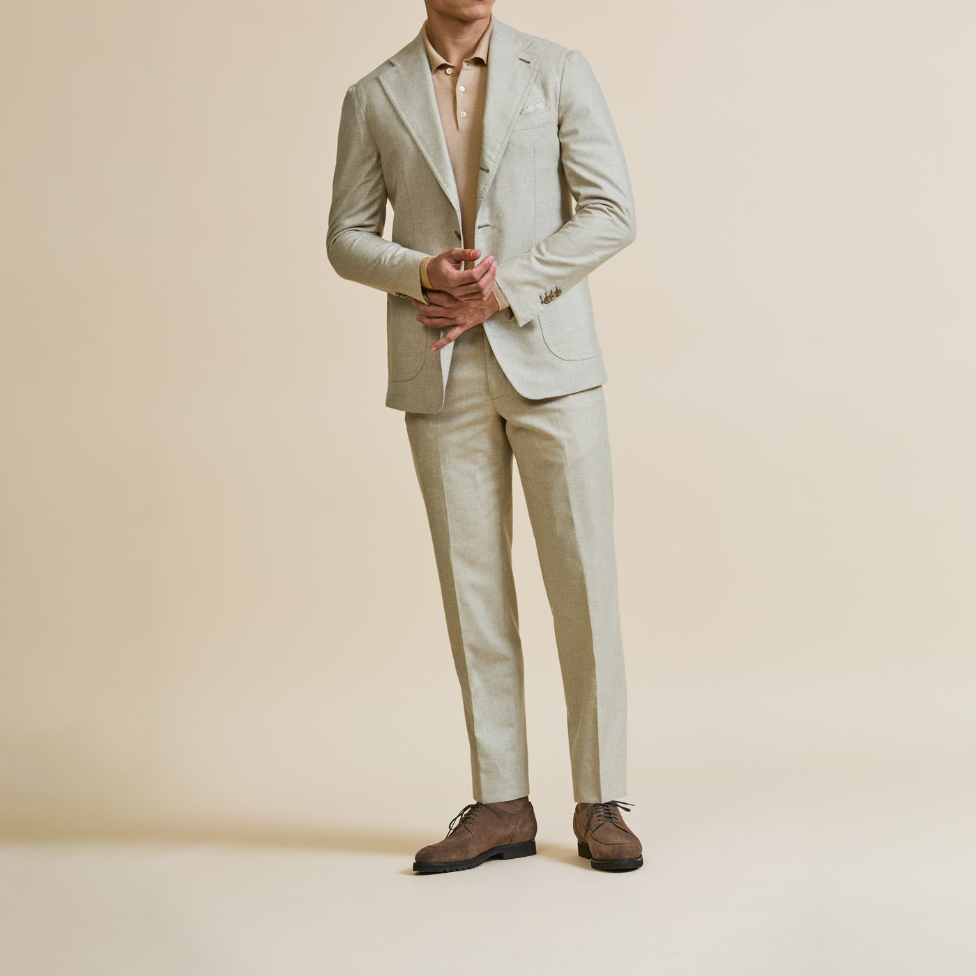 A man modeling a Pearce Bespoke Greater Syracuse custom suit.
