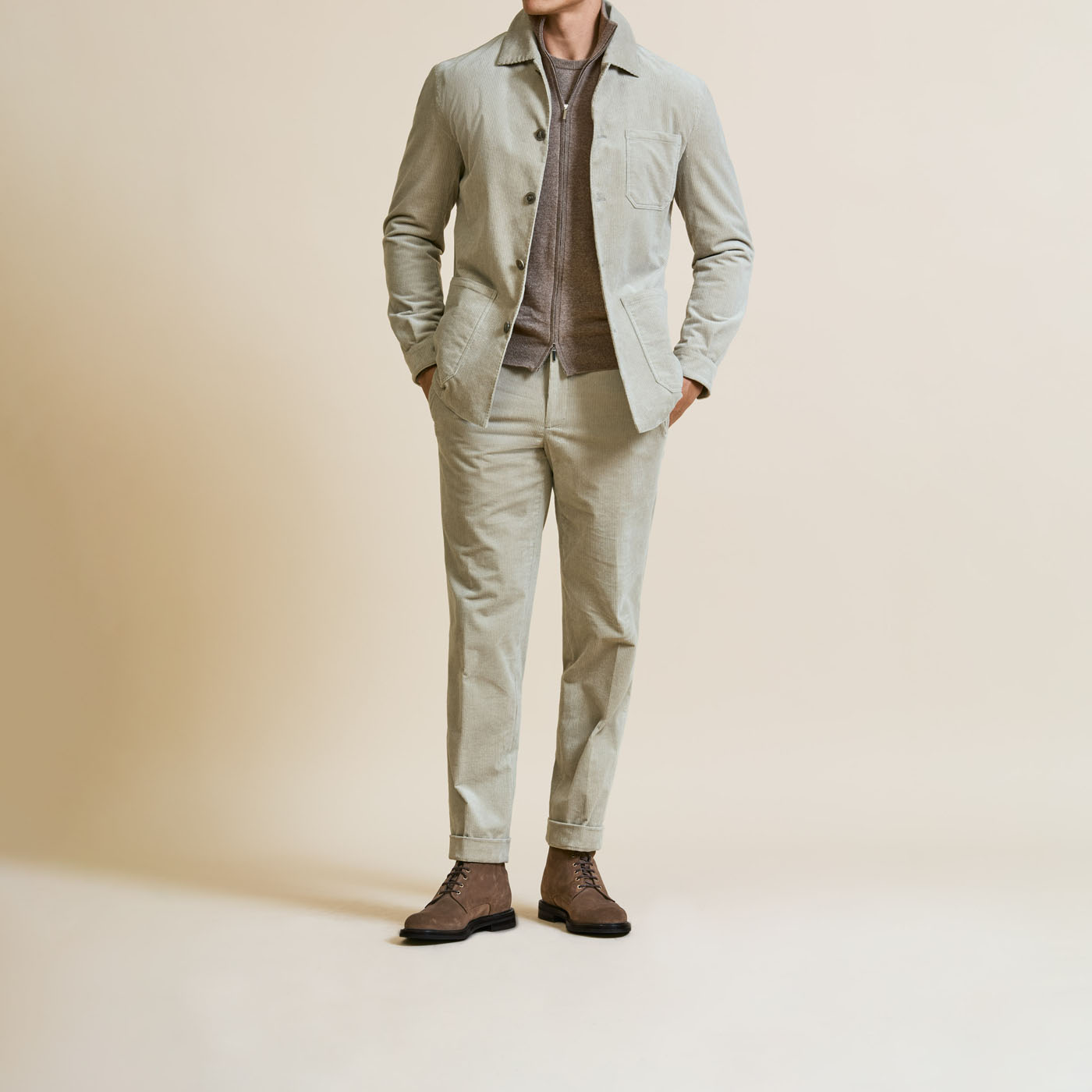 A person modeling a Pearce Bespoke Greater Syracuse tailored suit.