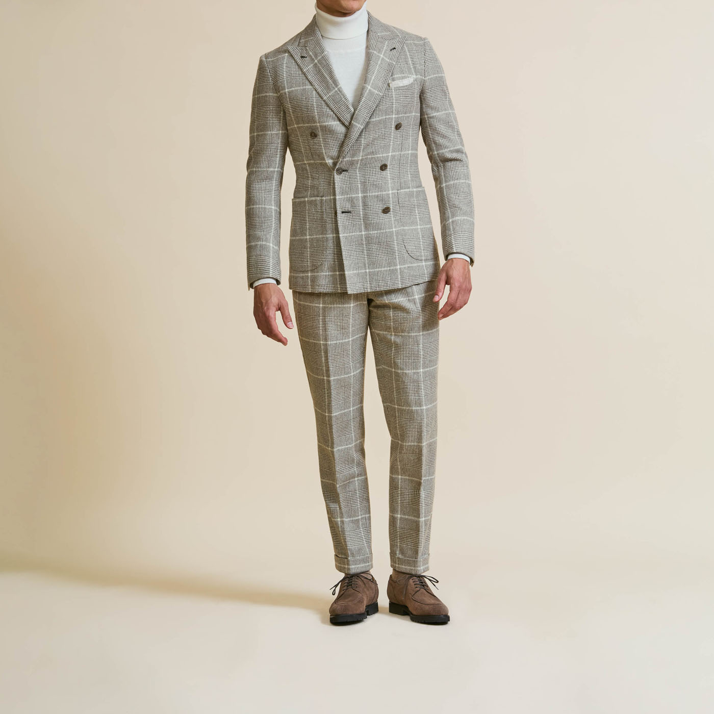 A plaid Pearce Bespoke Greater Syracuse custom suit on a male model.
