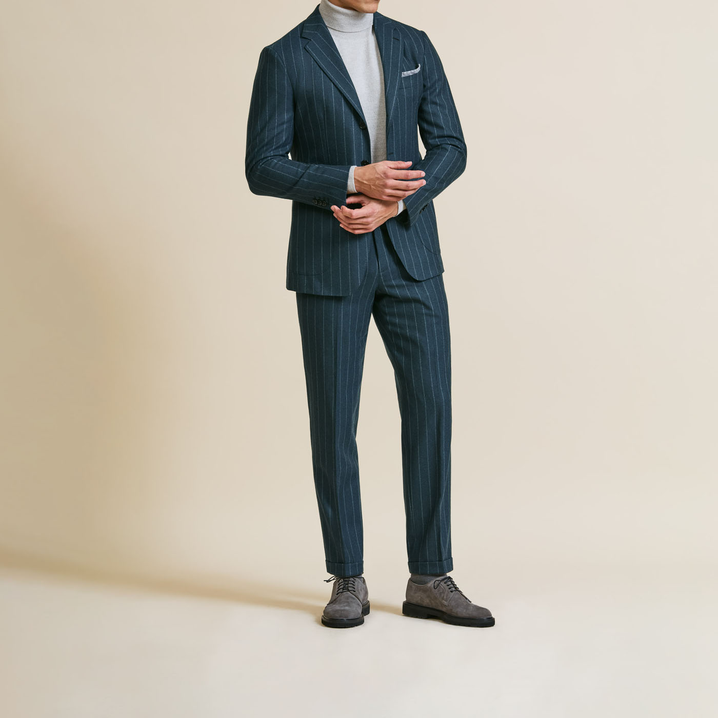 A Pearce Bespoke Greater Syracuse custom suit on a male model in a casual pose.