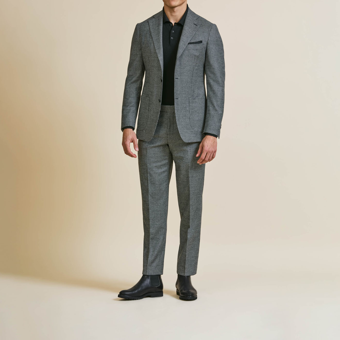 A Pearce Bespoke Greater Syracuse custom suit coat and pants on a male model.