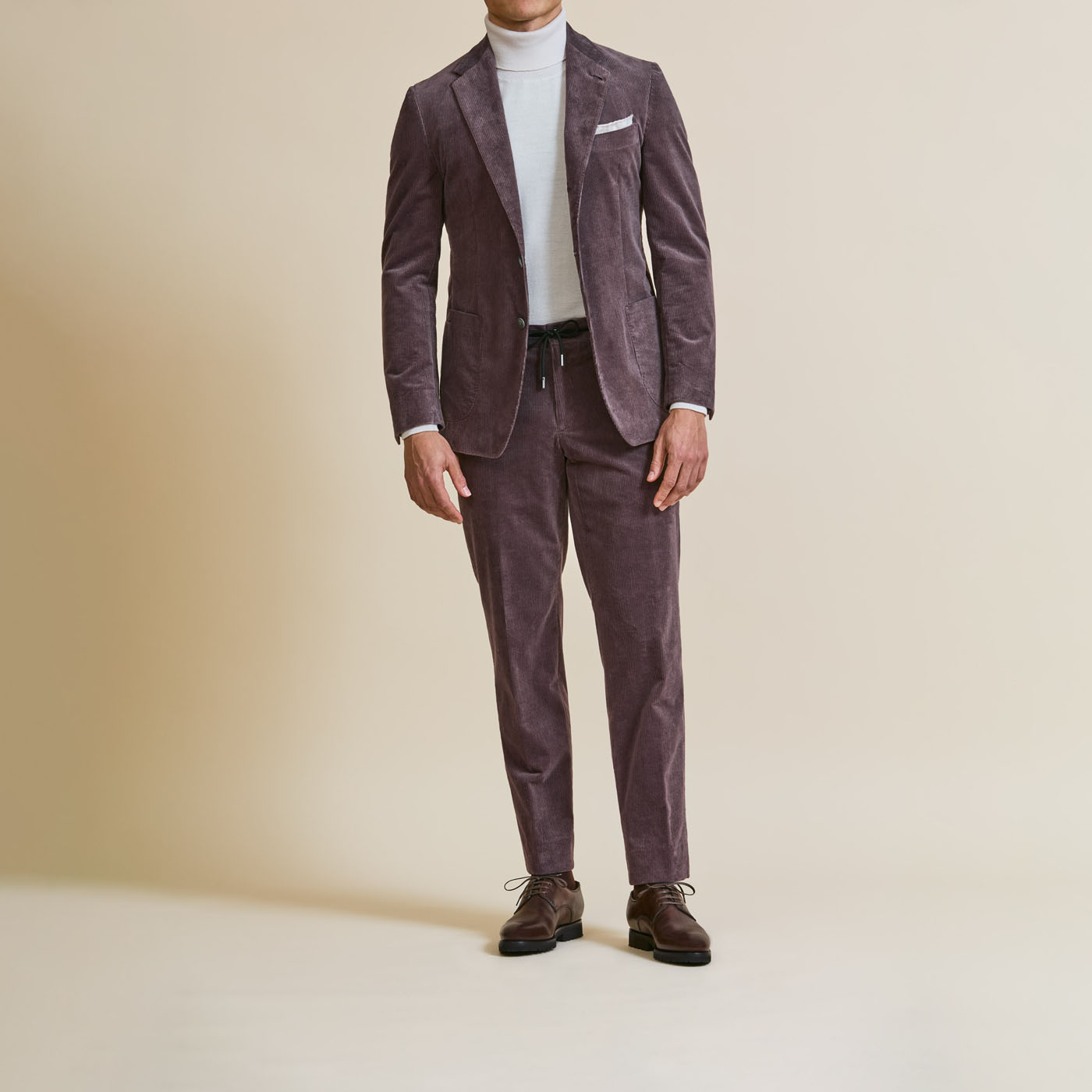 A plum-colored Pearce Bespoke Greater Syracuse custom suit on a male model.