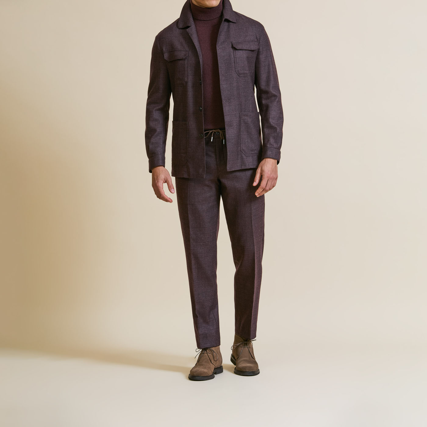 A casually styled, plum Pearce Bespoke Greater Syracuse tailored suit.
