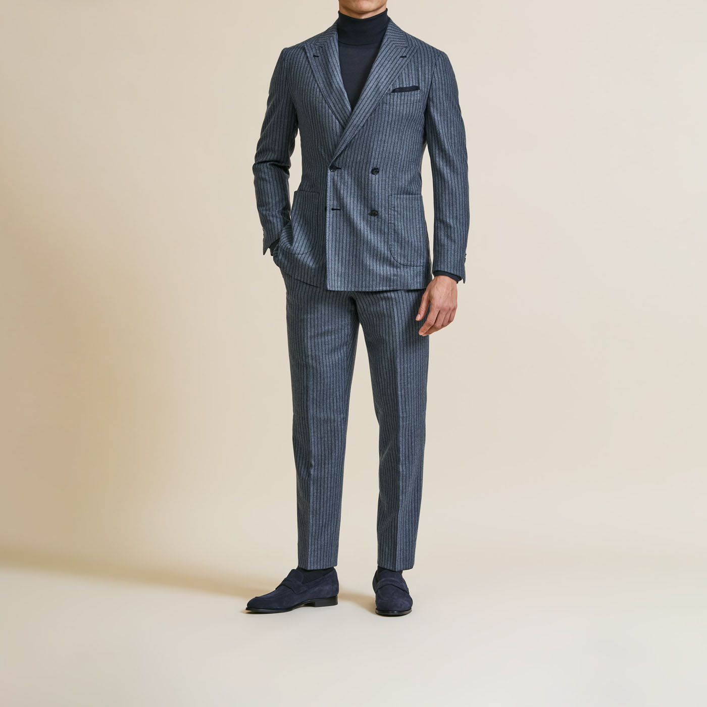 A textured gray Pearce Bespoke Greater Syracuse tailored suit.