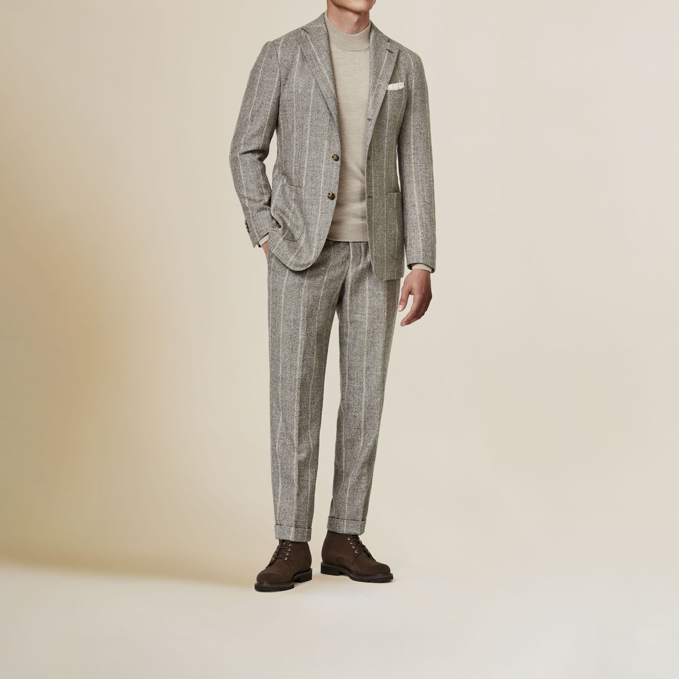 A light gray Pearce Bespoke Greater Syracuse custom suit with white pinstripes.