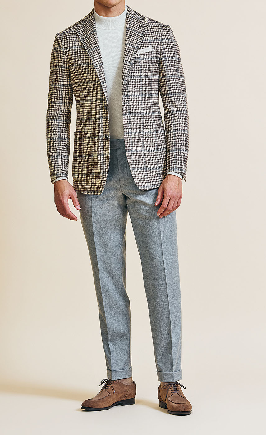 A Pearce Bespoke Greater Syracuse plaid sportscoat on a male model.