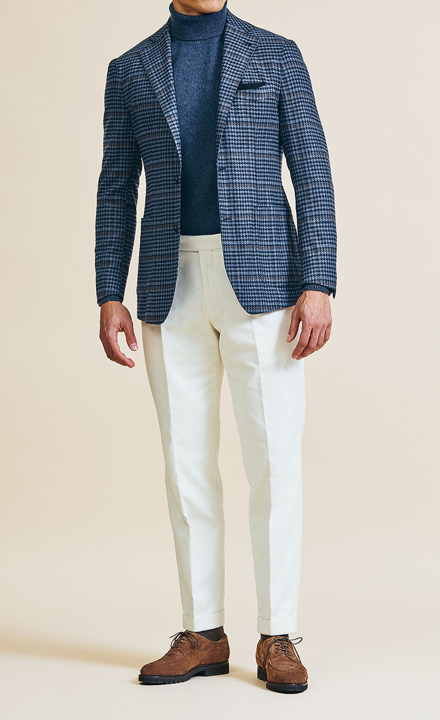 A Pearce Bespoke Greater Syracuse navy plaid sportscoat on a male model.