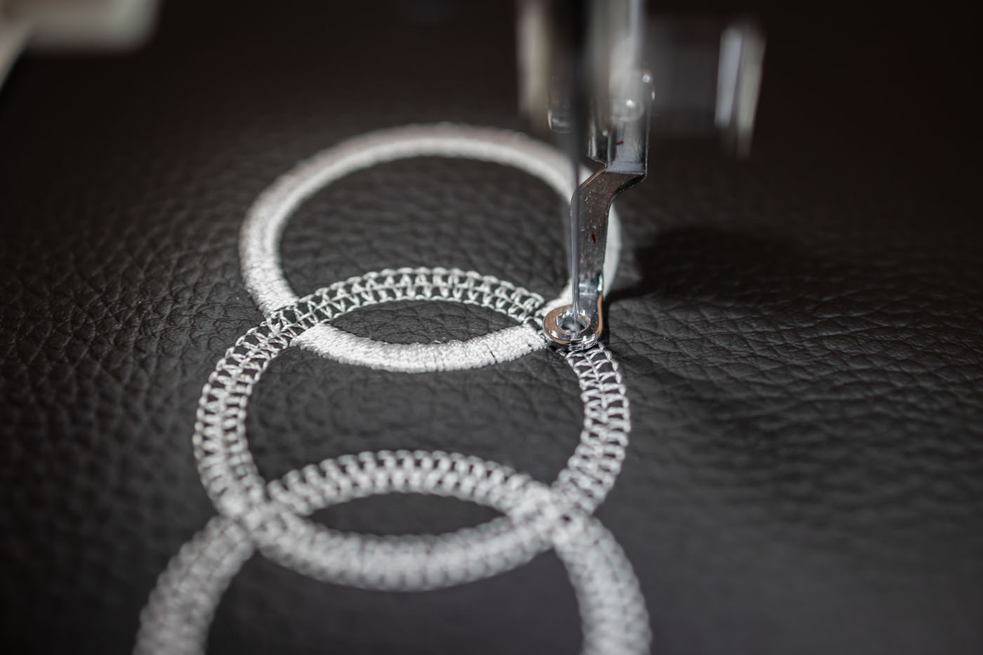 Stitching from one of Pearce Bespoke's New Orleans custom branding for suits.