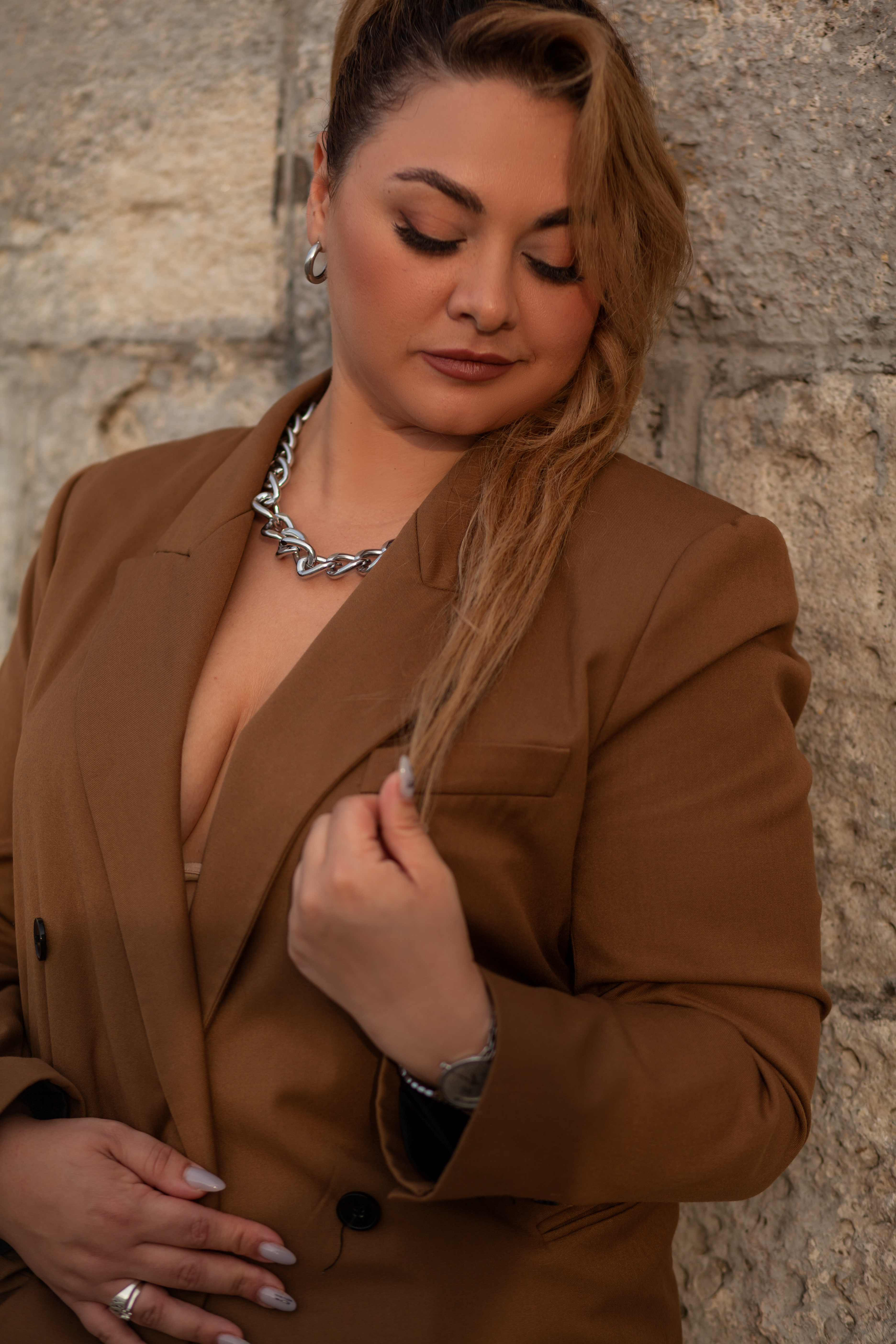 A woman in one of Pearce Bespoke's tailored suits for plus size ladies.