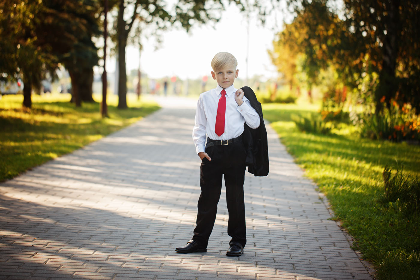 A boy wearing one of Pearce Bespoke's custom teenage suits in New Orleans, LA.
