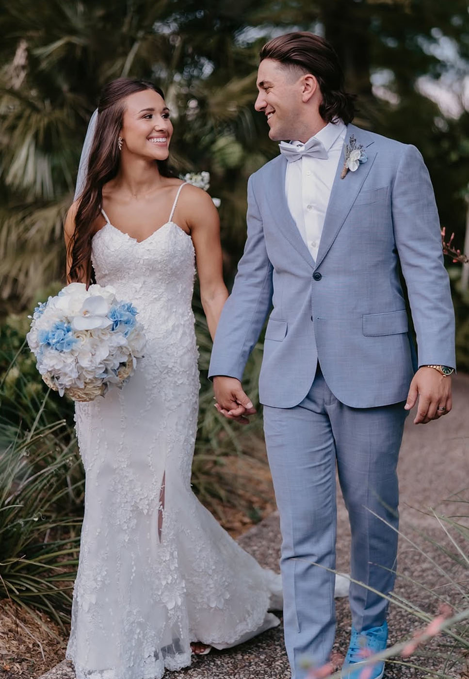 A bride and groom walking in New Orleans, LA.