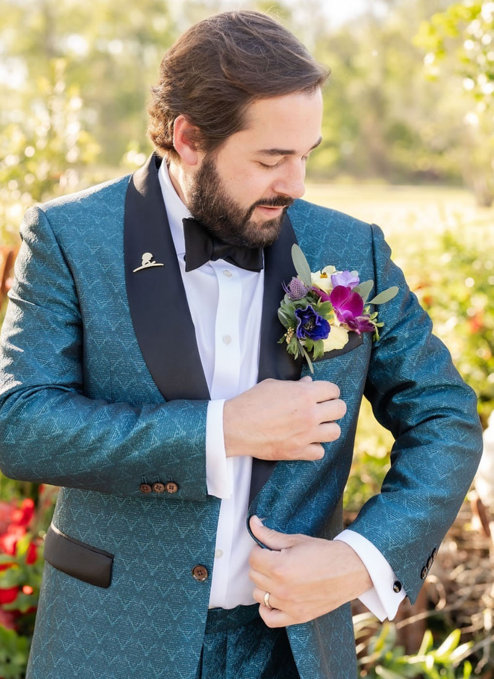 A groom in a green custom wedding suit in New Orleans, LA.